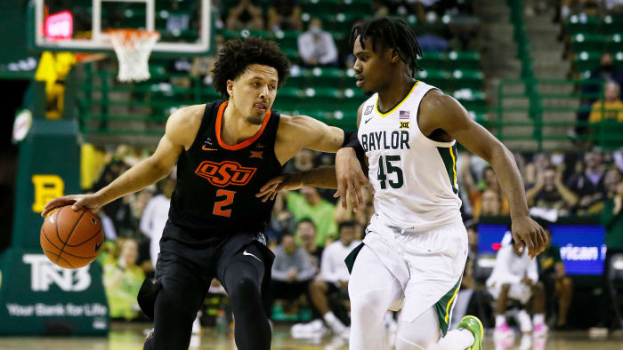 Cade Cunningham dribbles against Davion Mitchell